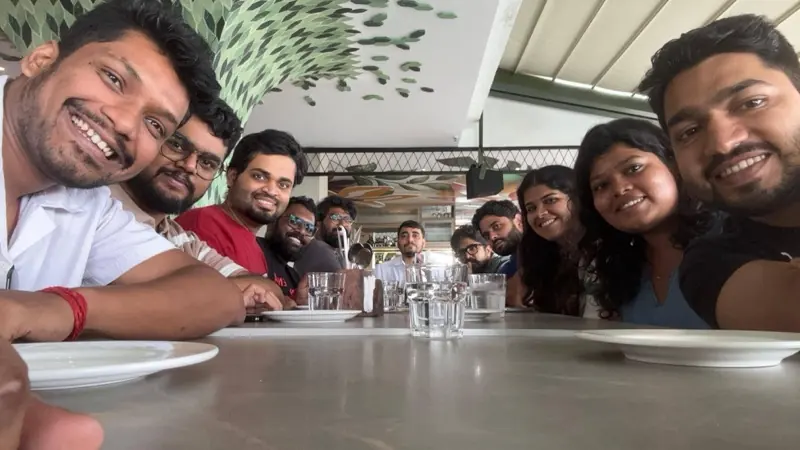 A full table of colleagues mid-session