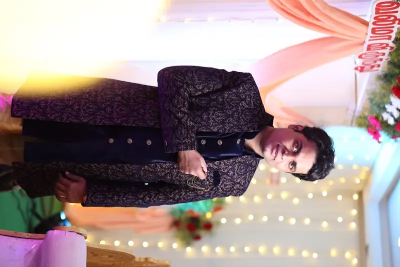 In a sherwani at a wedding